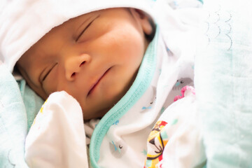 Fototapeta na wymiar Cute asian baby newborn close up