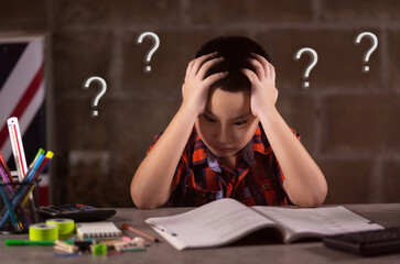Asian boy student doing homework at home. Online Education and learning for kids concept.
