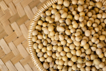 Soybeans in a wooden bowl on the table