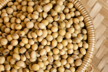 Soybeans in a wooden bowl on the table