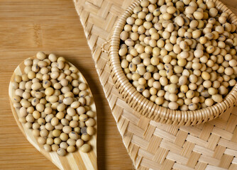 Soybeans in a wooden spoon on the table