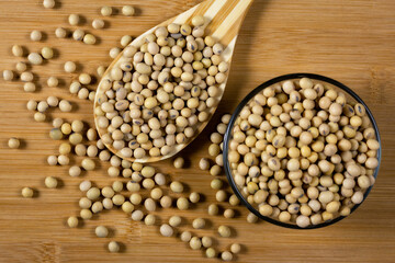 Soybeans in a wooden spoon on the table