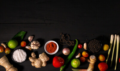 spices with ingredients on dark background. asian food, healthy or cooking concept.