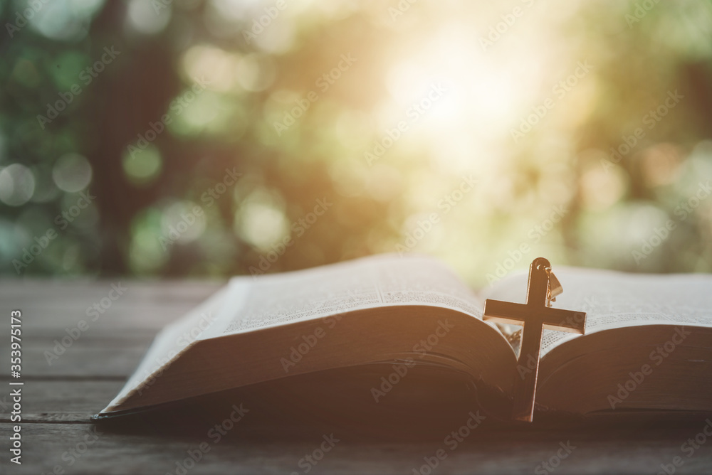 Wall mural bible book put on wood desk table old vintage for background.