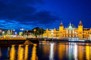 Amsterdam centraal station or Amsterdam central at night, The Netherlands