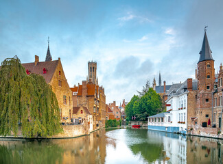 Bruges Belgium vintage stone houses and bridge over canal ancient medieval street picturesque landscape, Bruges, Belgium.