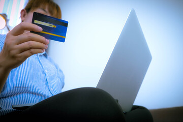 Using a credit card to buy things online for your holiday at home for pleasure and as a business online.