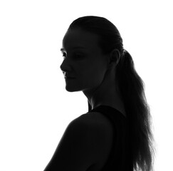 Female person silhouette in the shadow, back lit light