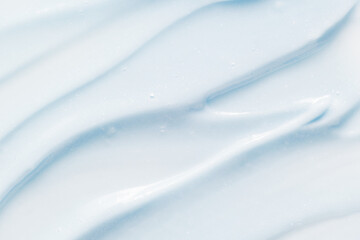 Toothpaste texture. Blue color abrasive dental paste smudged closeup