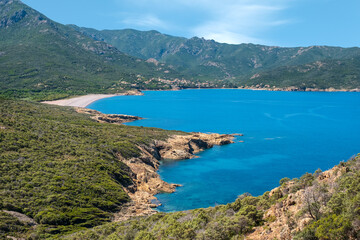Rocky coast and deserted beach at Galeria in Corsica