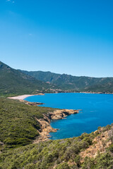 Naklejka na ściany i meble Rocky coast and deserted beach at Galeria in Corsica