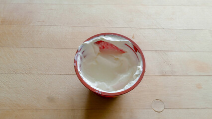 dairy product sour cream in a plastic Cup