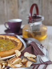 Pastry background.A large round open pie filled with dried Apple chips. Delicious dessert for tea.