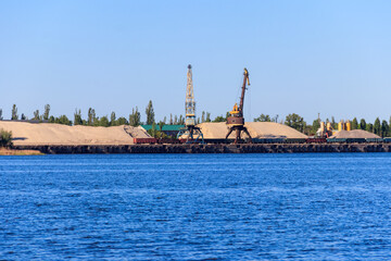 Hoisting cranes at cargo port on the Dnieper river in Kremenchug, Ukraine