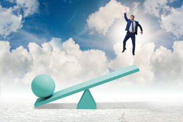 Career progression concept with businessman and seesaw