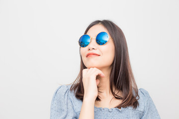 Fashion model asian girl posting with sunglasses isolated over white background