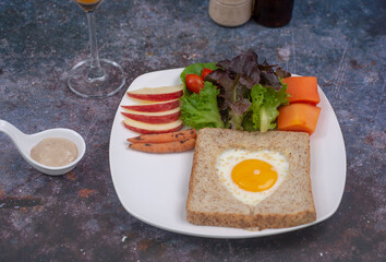  View from above bread toast with fried egg and  vegetables salad.  healthy food breakfast, soft focus. healthy food.
