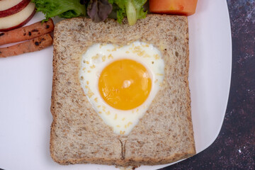  View from above bread toast with fried egg and  vegetables salad.  healthy food breakfast, soft focus. healthy food.