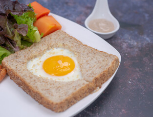  View from above bread toast with fried egg and  vegetables salad.  healthy food breakfast, soft focus. healthy food.