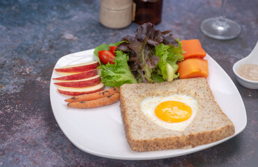  View from above bread toast with fried egg and  vegetables salad.  healthy food breakfast, soft focus. healthy food.