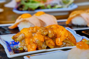 Foie gras sushi with sauce on top, Japanese food 