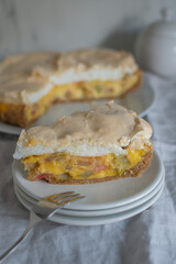 Home made rhubarb meringue cake on a plate