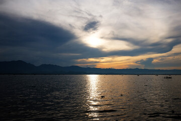 Destination of Beautiful Silhouette and  twilight of sunset Reflected light on the water surface and glittering waves in the River