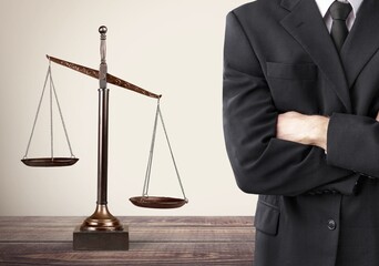 Businessman and justice scales on the table. Justice concept
