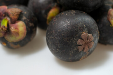 Close-Up Of Mangosteen Fruits On Table