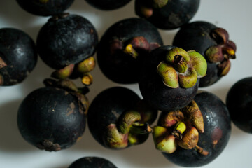 Close-Up Of Mangosteen Fruits On Table