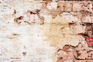 Obraz premium Weathered texture of stained old orange and white brick wall background