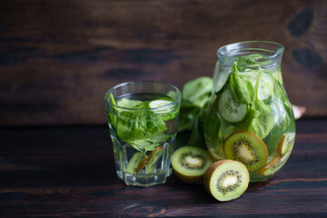 Detox drink. Infused water with kiwi and cucumber. Green lemonade, summer refreshing beverage