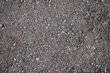 Background image of the surface of a gravel walking path
