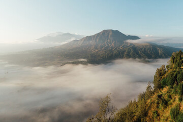 Sunrise Mountain location Mountain Batur kintamani Bali Indonesia. A misty morning sunrise in  the mountain. Travel Indonesia concept