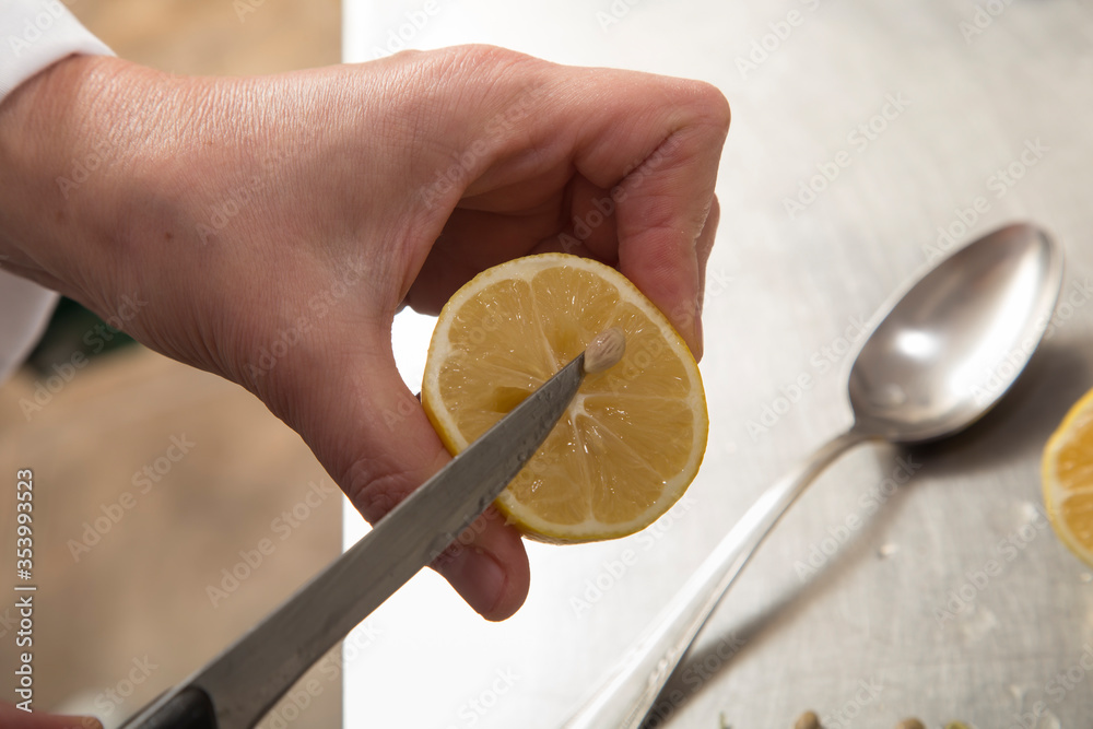 Wall mural How to squeeze the juice from lemon.