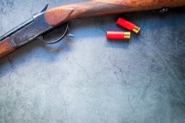 Old hunting rifles and ammunition on a dark background with a top view and place for your text.