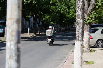 Fast food delivery on scooters in the city.