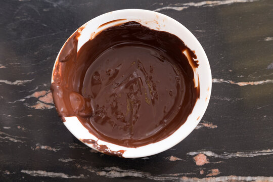 Melted Hot Chocolate In A White Plastic Bowl.