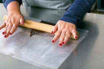 Making chocolate chips to decorate baking by hand.