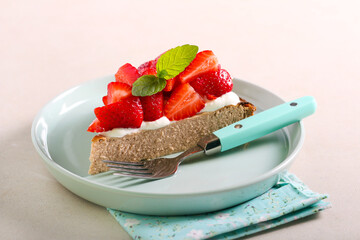 Coffee cheesecake with cream and strawberry topping