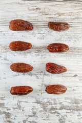 dried date fruits on a white background