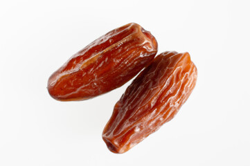 dried date fruits on a white background