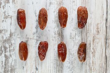 dried date fruits on a white background