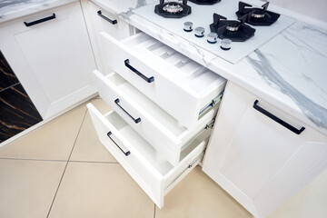 Solutions for placing utensils in modern kitchen - horizontal sliding pullout drawer shelves...