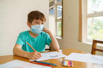 Young boy stuck at home during isolation