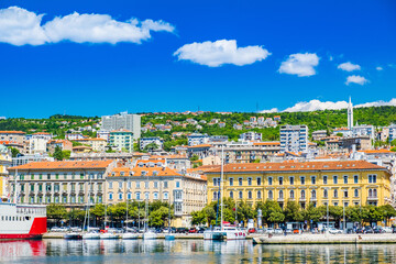Waterfront view of the city of Rijeka, Croatia. Boats in marina and old classic monumental buildings in background.