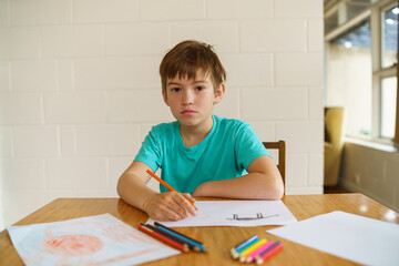 Young boy stuck at home during isolation