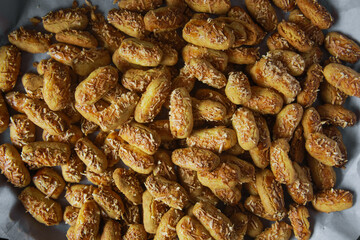 close up photo of Kaastangels,  cookies made from a mixture of flour, eggs, margarine, and grated cheese. This is Indonesian Speciality Cookies For Eid al-Fitr called kue lebaran