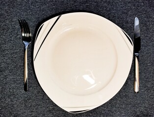 empty plate with fork and knife