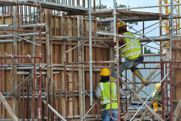 JOHOR, MALAYSIA -JUNE 30, 2016: Scaffolding used as the temporary structure to support platform, form work and structure at the construction site. Also used it as a walking platform for workers. 

